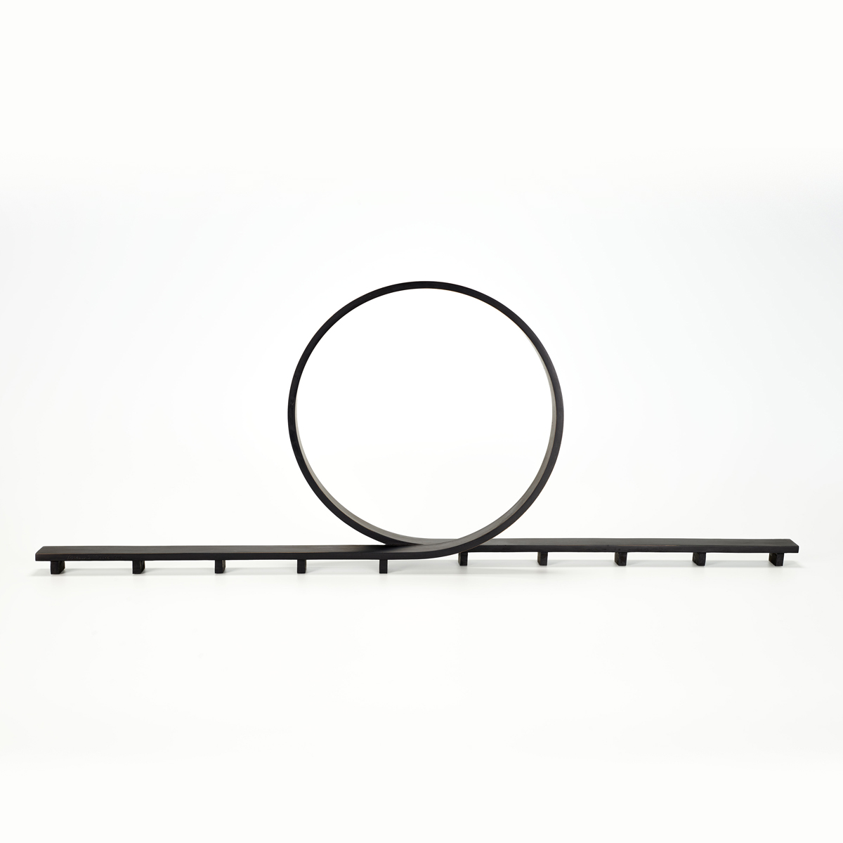 patinated bronze ribon like loop sculpture